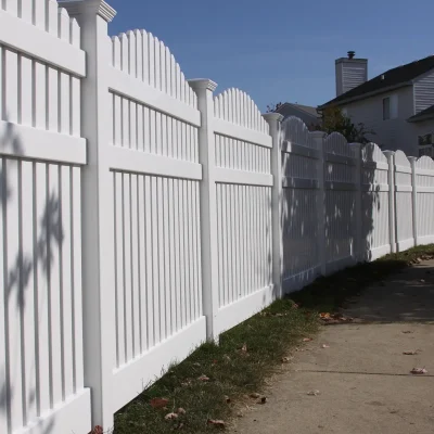 vinyl spaced fence running alongside a sidewalk