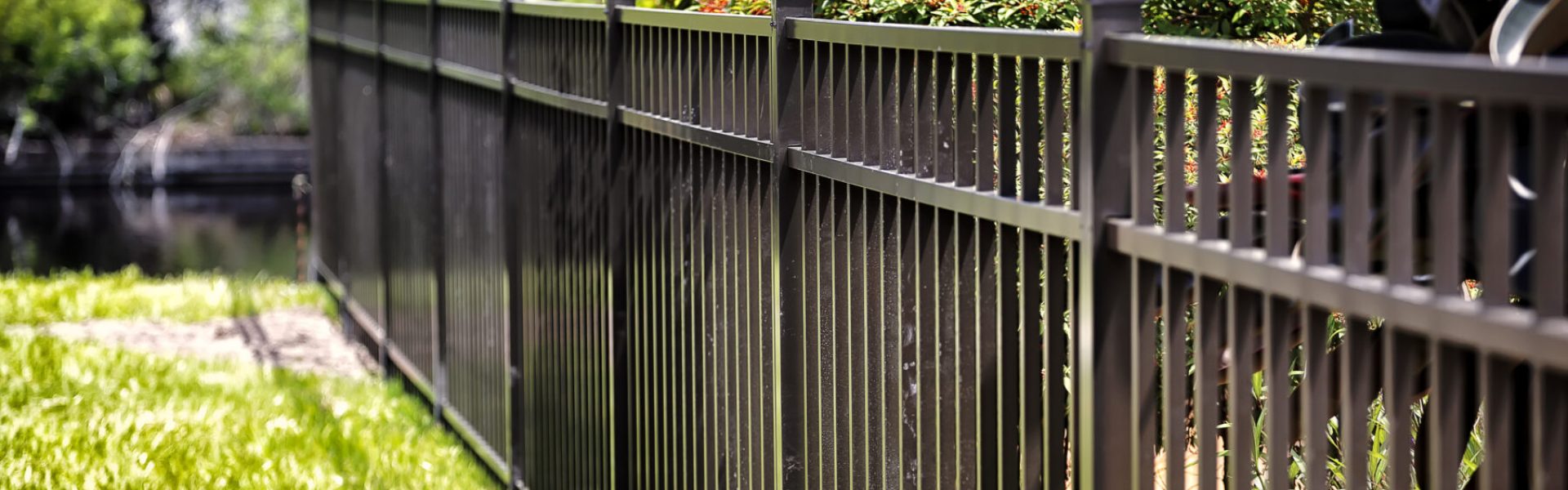 black aluminum fence in backyard